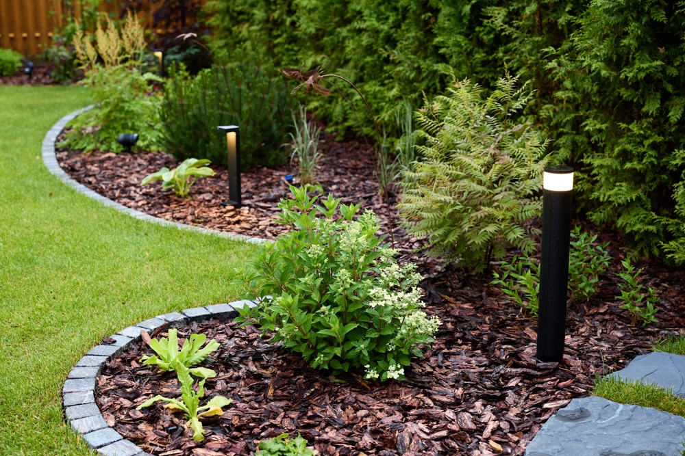 A,beautifully,landscaped,garden,featuring,striking,led,lights,and,fresh