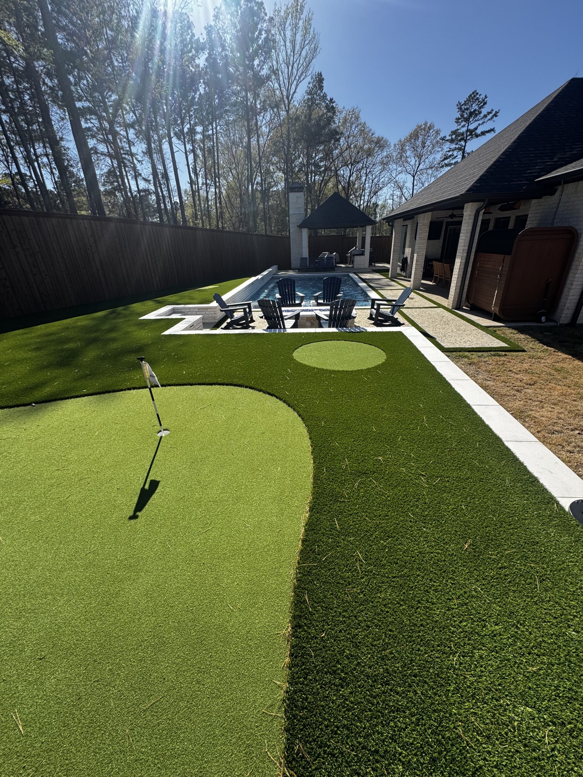 Custom Backyard Lighting: Putting Green, Pool, and Firepit Design